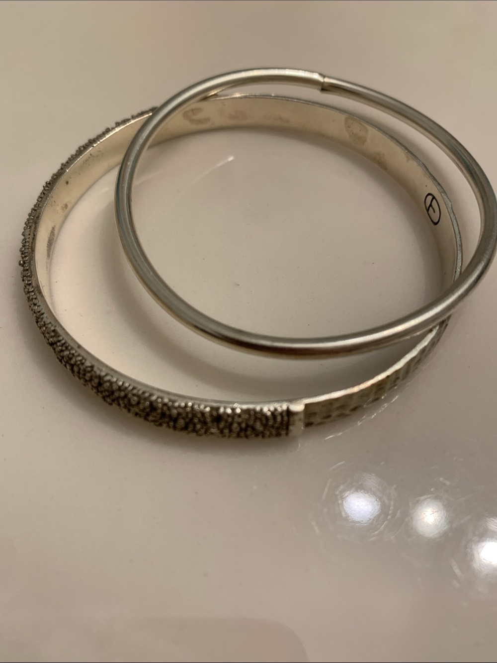 Two bangles , West Coast inspired. Used in silver tone . Both look good , as is